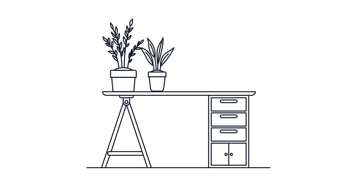 Black and white image of an office desk with two plants on top of it but no chair